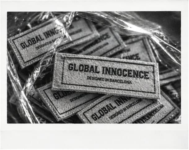 Woven Global Innocence labels, Designed in Barcelona.